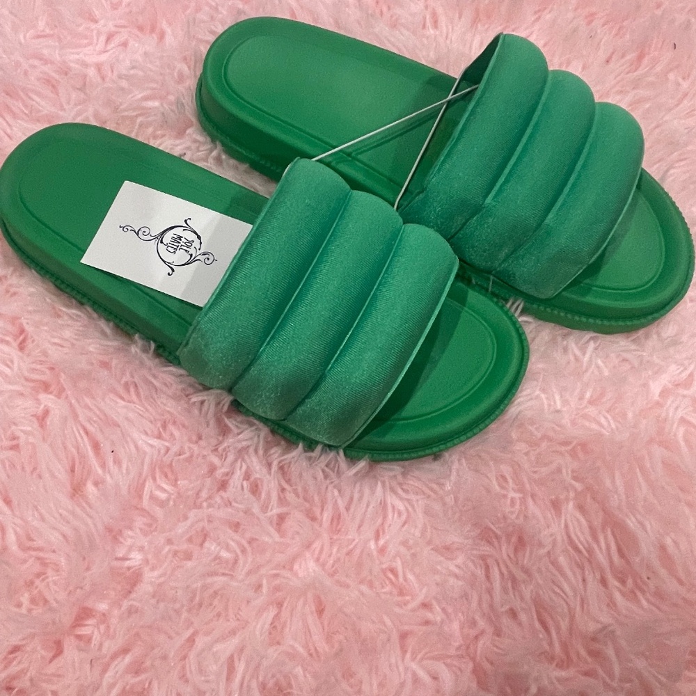 Never worn green slides